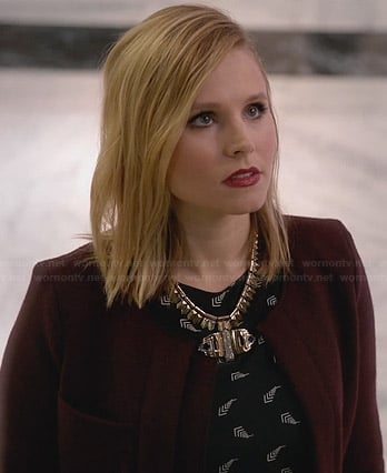 Jeannie's black printed dress and burgundy jacket on House of Lies