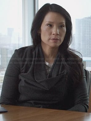 Joan's grey asymmetric zip cardigan on Elementary