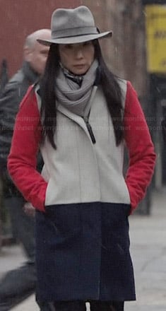 Joan's color block coat with red sleeves on Elementary