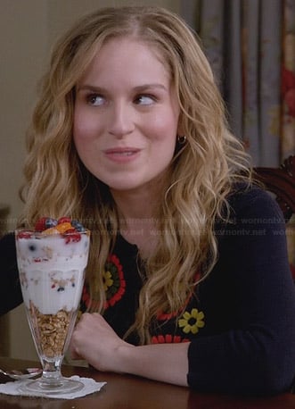 Lisa's navy blue cardigan with orange and yellow flowers on Suburgatory