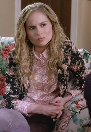 Lisa's orange floral shirt and black rose print jacket on Suburgatory