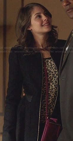 Thea's black zip front coat with leather waistband on Arrow