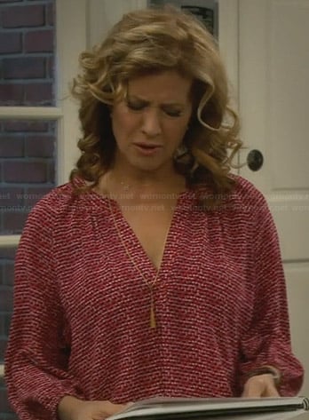 Vanessa's red printed blouse on Last Man Standing