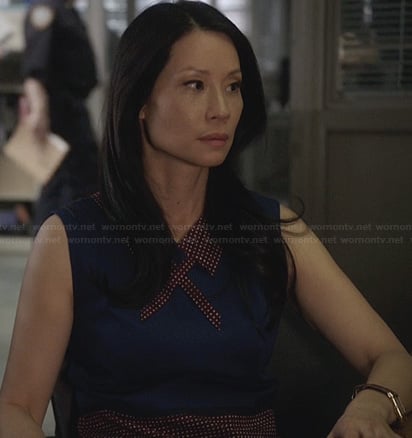 Joan's blue dress with burgundy polka dot collar and skirt on Elementary