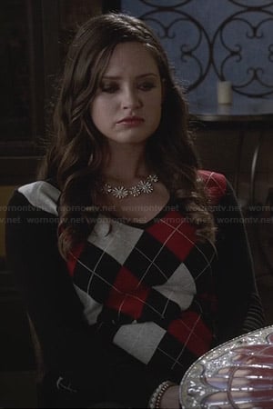 Olivia's red and black argyle sweater on Ravenswood