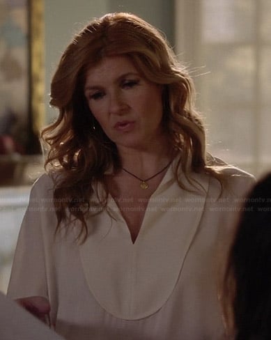 Rayna's white bib front blouse on Nashville