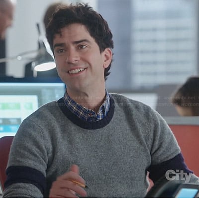 Andy's grey sweater with navy sleeve bands on The Crazy Ones