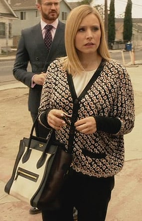 Jeannie's flower printed cardigan and black and white bag on House of Lies