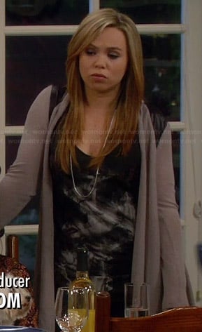 Kristin's black graphic tank top and taupe cardigan with leather shoulders on Last Man Standing