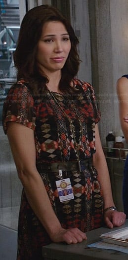 Angela's orange and black printed dress on Bones