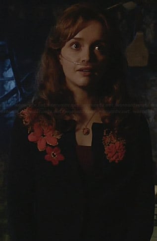Emma's navy cardigan with orange floral applique on Bates Motel