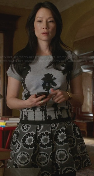 Joan's grey palm tree printed pleated drop-waist dress on Elementary