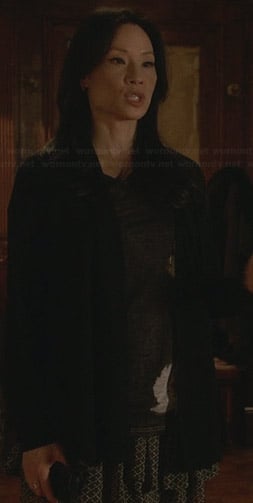 Joan's tiered printed skirt and black tee on Elementary