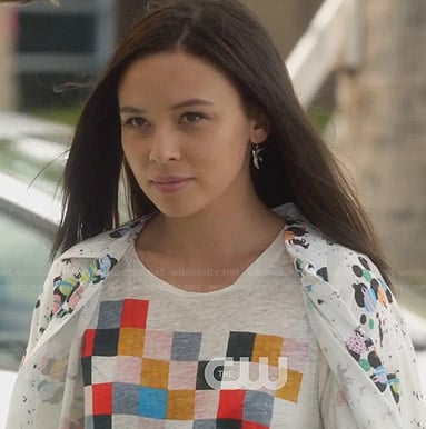 Julia's multi colored checkerboard tee and planet print shirt on Star-Crossed