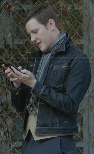 Nolan's denim zip-pocket jacket and striped scarf on Revenge