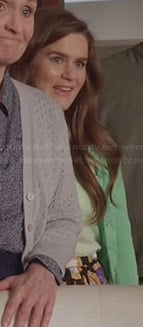 Betsey's green cardigan and black printed skirt on The Mindy Project