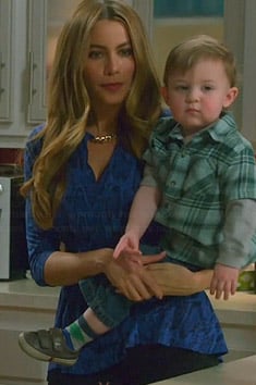 Gloria's blue snake print peplum top on Modern Family