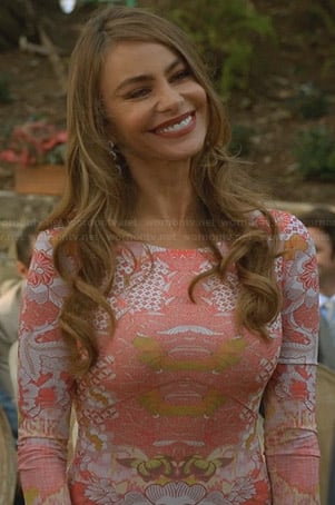 Gloria's pink mirrored print maxi dress at the wedding on Modern Family