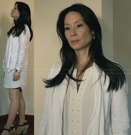 Joan's white studded trim dress and cardigan and ankle boots on Elementary