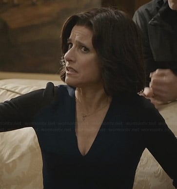 Selina's navy blue v-neck dress with black sleeves on Veep