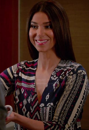 Carmen's navy and pink geometric patterned wrap top on Devious Maids