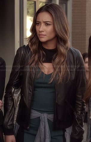Emily's teal green bodycon dress with cutout chest, leather jacket and silver bag on Pretty Little Liars