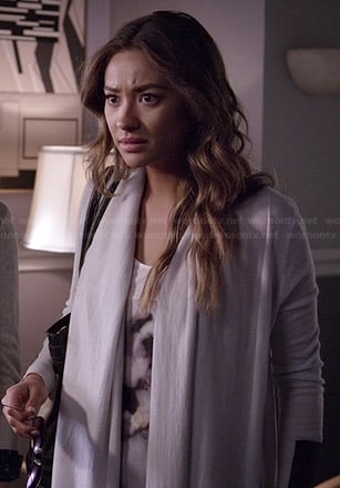 Emily's white graphic tank top and draped cardigan with leather panels on Pretty Little Liars