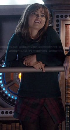 Clara's plaid asymmetric skort and sweater with leather collar on Doctor Who