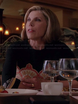Diane's black and orange printed dress on The Good Wife