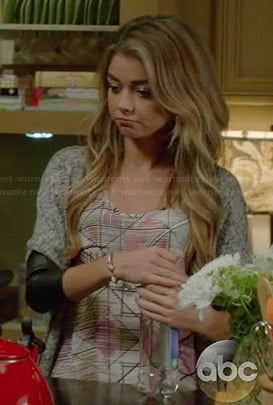 Haley's printed top and leather sleeved cardigan on Modern Family