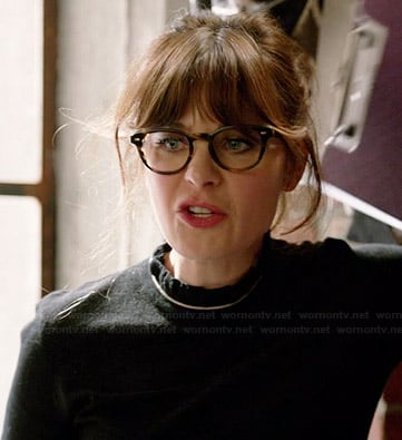 Jess's black ruffled neck top on New Girl
