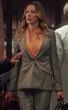 Laurel's orange blouse and grey blazer on Arrow
