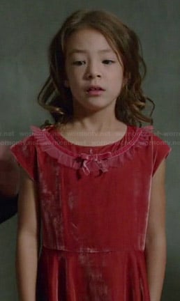 Lily's red velvet bow dress on Modern Family