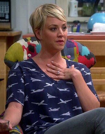 Penny's plane printed top and black and white loafers on The Big Bang Theory