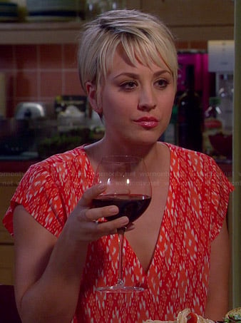 Penny's red and orange ikat printed v-neck top on The Big Bang Theory