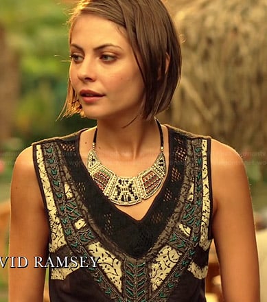Thea's black embroidered crossover top and bib necklace on Arrow