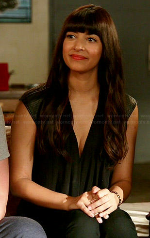 Cece's black wrap top with leather shoulders on New Girl