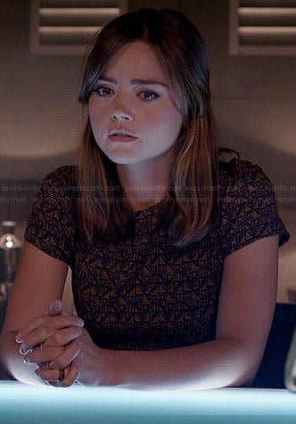Clara's orange and navy geometric patterned dress on Doctor Who