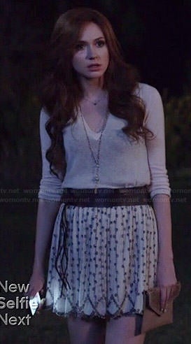 Eliza's white beaded skirt and v-neck sweater on Selfie
