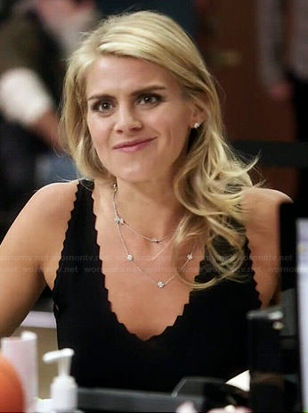 Nina's black jagged edge tank top on Benched