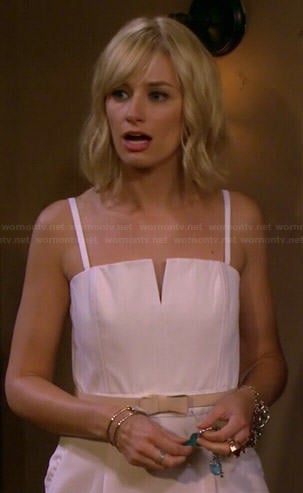 Caroline's white split neck jumpsuit on 2 Broke Girls