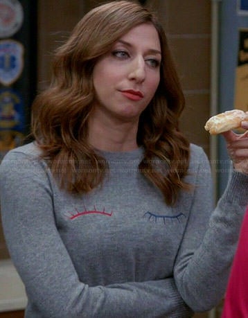Gina's grey eyelash wink sweater and red plaid pants on Brooklyn Nine-Nine