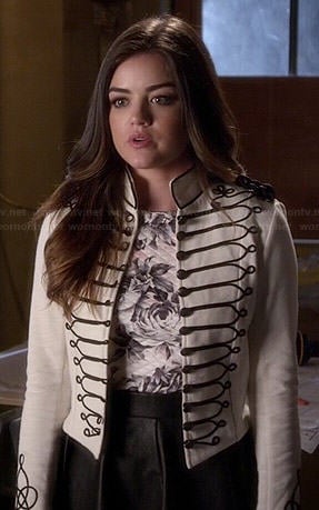 Aria's white military style jacket, rose print top and pleated leather skirt on Pretty Little Liars