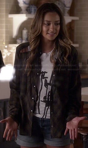 Emily's white drawing graphic top and plaid shirt with lace up shoulders on Pretty Little Liars