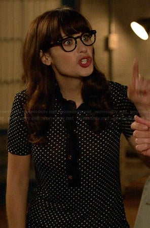 Jess's black and white polka dot top with ruffle trim on New Girl