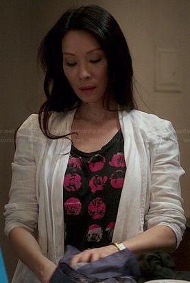 Joan's black and pink graphic tee on Elementary