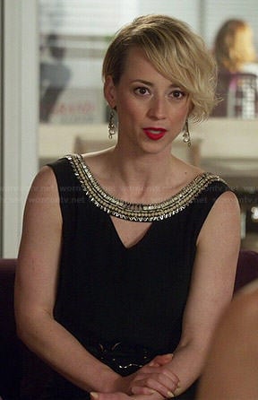 Margaux's black beaded neck top with triangle cutout on Revenge