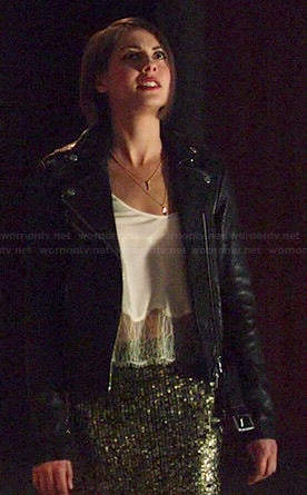 Thea's white lace hem cami, gold sequin skirt and leather jacket on Arrow