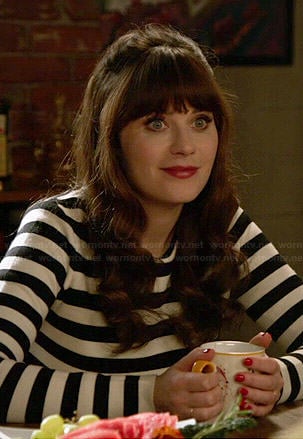 Jess's black and white striped zip-back sweater on New Girl