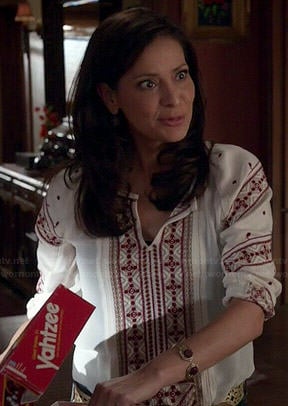 Regina's white top with red embroidery on Switched at Birth